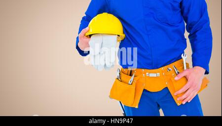 Digital composite of Carpenter with gloves against cream background Stock Photo