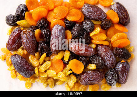 dried fruit isolated on white background. dates, raisins, dried apricots, prunes Stock Photo
