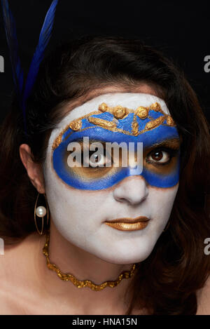 close up portrait of women with mask makeup on black background Stock Photo