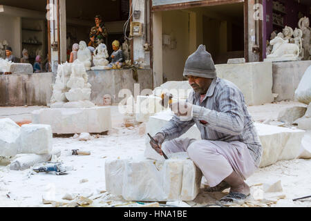 Rajasthan, India, 21st January 2017 - Artisans carving Hindu gods and  saints from white marble. Stock Photo