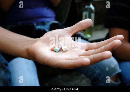 Teenagers take drug    Credit  © Luigi Innamorati/Sintesi/Alamy Stock Photo