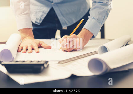 architect, engineer working on construction project at office Stock Photo
