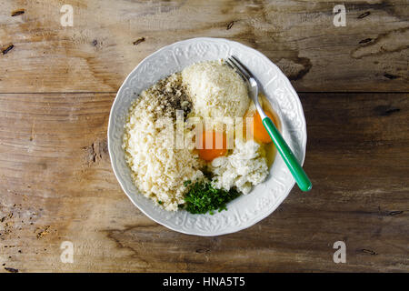 ingredients in bowl to prepare cheese meatballs Stock Photo