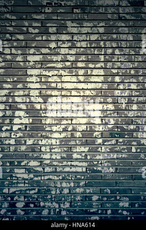 Stained brick wall, detail of a brick wall paper stained Stock Photo