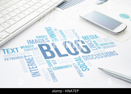 Blog concept cloud chart print document, keyboard, pen and smartphone. Stock Photo