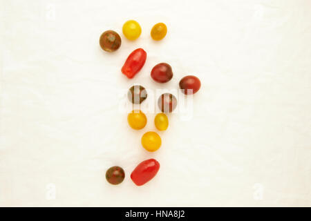 Cherry tomatoes on a textured cloth background Stock Photo