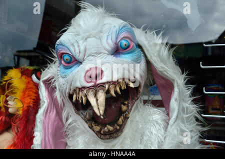 Scary monster mask and costume in a shop window display Stock Photo