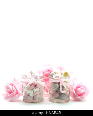 Easter Treats with mini eggs pink roses and Marshmallows on a white background Stock Photo