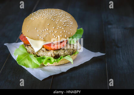 Closeup of home made burgers on wooden background Stock Photo