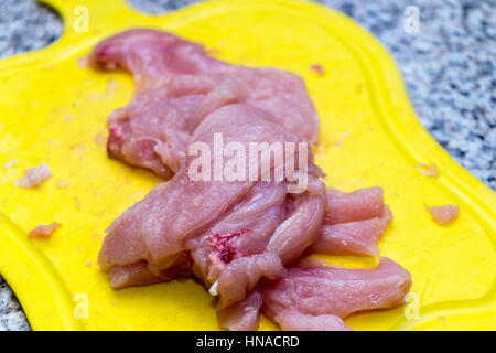 raw chicken filet on cutting board Stock Photo