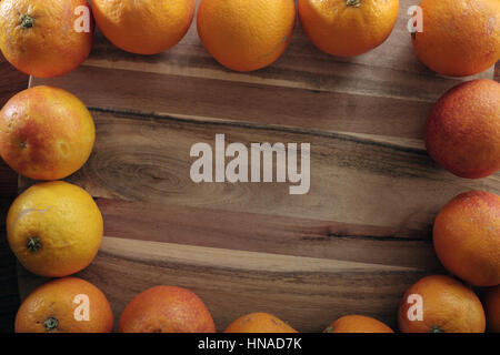 Several Red oranges on cutting board