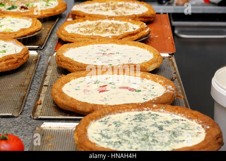 Vegetable tart ready for baking in the bakery Stock Photo