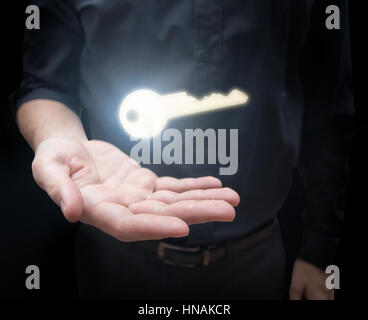 man with shining key Stock Photo