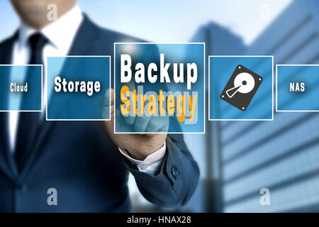 Backup Strategy touchscreen is operated by a businessman. Stock Photo