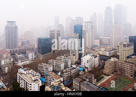 NANJING, CHINA - MARCH 18: Xinjiekou financial district in Nanjing on a foggy day. This is the downtown area of Nanjing where many banks and offices c Stock Photo