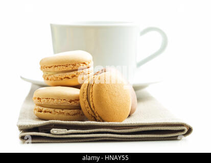 Coffee macarons and coffee cup isolated on white background. Stock Photo