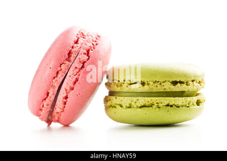 Strawberry and pistachio macaroons isolated on white background. Stock Photo