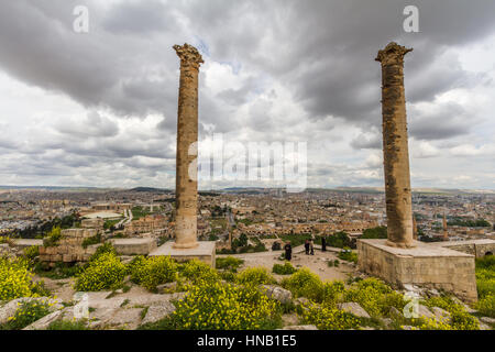 Photo taken from Urfa Castle two pillar, some castle structures and the city is on the picture. Stock Photo
