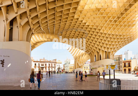 Seville, Spain - May 1, 2016: People walking on Plaza Mayor, the lower level of Espace Metropol Parasol, world’s largest wooden structure