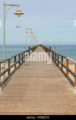 Göhren, Germany - September 22, 2016: The wooden pier at the Baltic Sea beach on a  late summer day. The structure is 350 m long and was reconstructed Stock Photo