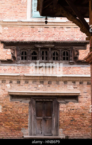 The wall, the window and the door, in an old house in Kathmandu built in traditional Nepali style Stock Photo