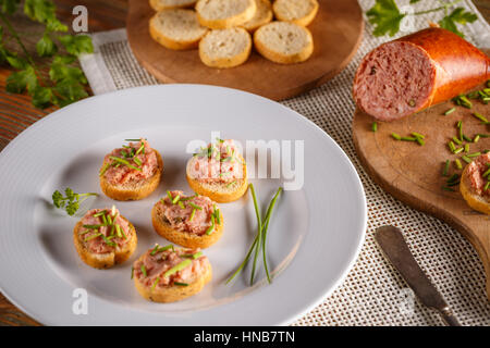 Bread and tea sausage spread with chopped chives Stock Photo