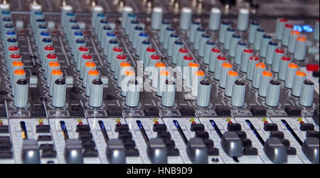 Large mixing console shot close-up during the operation Stock Photo