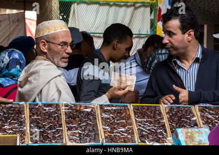 Rissani, Morocco.  Customer Buying Dates in the Market. Stock Photo