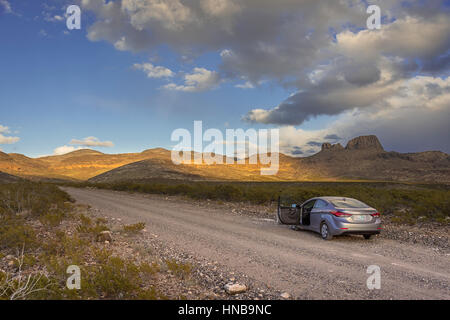 Car On Desert Dirt Road, Arizona USA Stock Photo