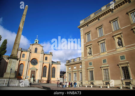 STOCKHOLM, SWEDEN - AUGUST 19, 2016: Church of St. Nicholas (Storkyrkan) and Obelisk located on the Slottsbacken street near the Royal Palace in Stock Stock Photo