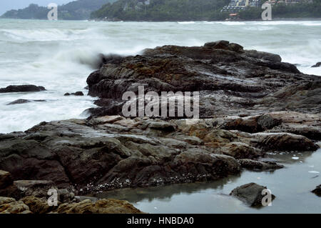 The coast of Phuket Island consists of sandy beaches inbetween rocky crags and outcrops, Thailand Stock Photo