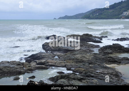 The coast of Phuket Island consists of sandy beaches inbetween rocky crags and outcrops, Thailand Stock Photo