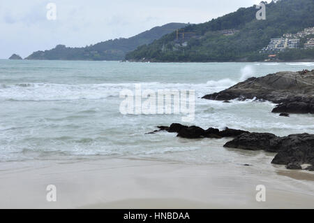 The coast of Phuket Island consists of sandy beaches inbetween rocky crags and outcrops, Thailand Stock Photo