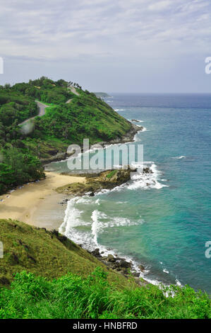 The coast of Phuket Island consists of sandy beaches inbetween rocky crags and outcrops, Thailand Stock Photo