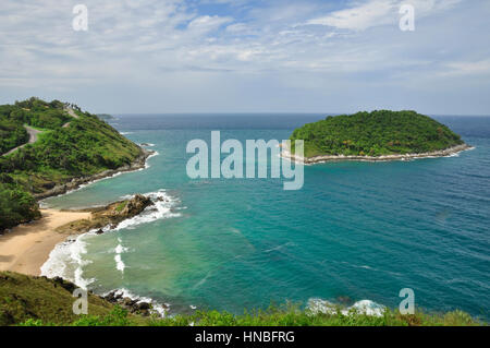 The coast of Phuket Island consists of sandy beaches inbetween rocky crags and outcrops, Thailand Stock Photo