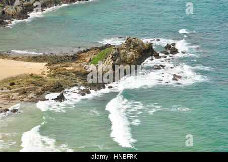 The coast of Phuket Island consists of sandy beaches inbetween rocky crags and outcrops, Thailand Stock Photo