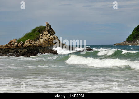 The coast of Phuket Island consists of sandy beaches inbetween rocky crags and outcrops, Thailand Stock Photo