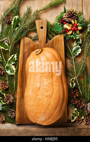 New Year's background and pumpkin on a cutting board Stock Photo