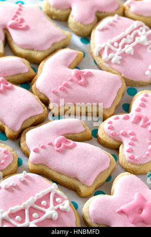Easter frame. Easter eggs, various cookies and confectionery sugar sprinkling on a wooden table. Stock Photo