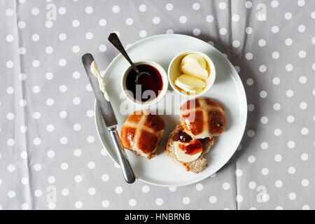 Homemade Hot Cross Buns Ready for Easter on morning table Stock Photo