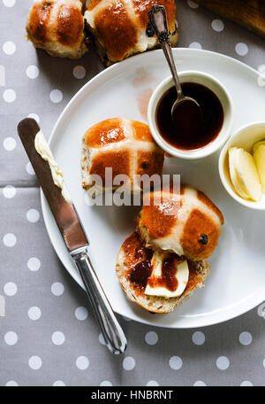 Homemade Hot Cross Buns Ready for Easter on morning table Stock Photo