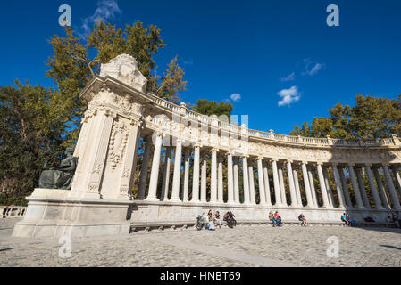 Madrid, Spain - November 13, 2016: Tourist visiting Alfonso XII monument on November 13, 2016 in Retiro park, Madrid, Spain. Stock Photo