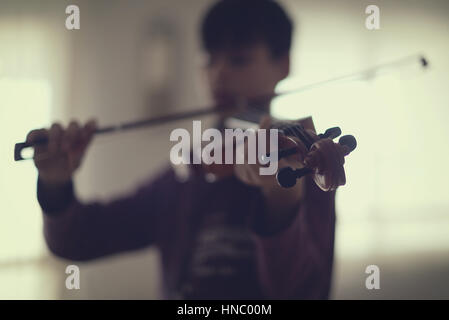 Boy playing the violin Stock Photo