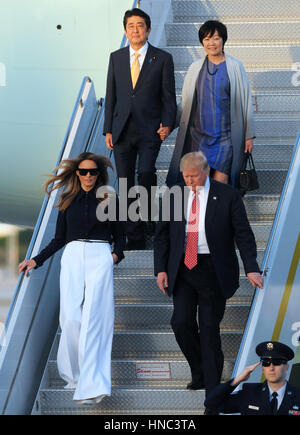 President Donald Trump walks with Japanese Prime Minister Shinzo Abe ...