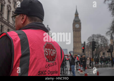 London, UK. 11th February 2017. Cyclist campaign group stage a   demo and 'Die In' outside the Treasury Office calling on the government to make roads safer  and  increase spending for Cycling by 10% by 2020. © claire doherty/Alamy Live News Stock Photo