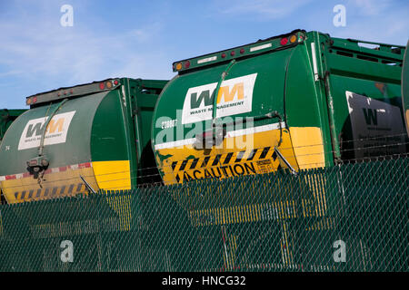 Logo signs on Waste Management, Inc., trucks in San Antonio, Texas on