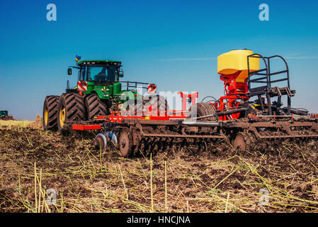 Tractor ploughing up the field.  Stock Photo