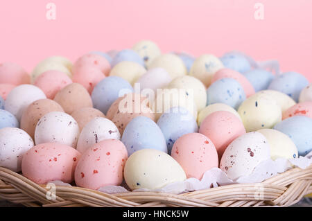 Basket full of pastel colored easter eggs Stock Photo