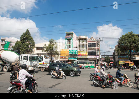 Scooter motorbike riders travelling through Ho Chi Minh city in Vietnam,Asia Stock Photo