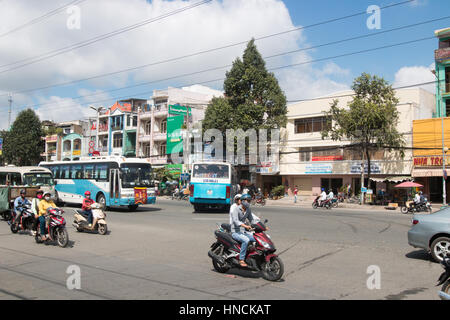 Scooter motorbike riders travelling through Ho Chi Minh city in Vietnam,Asia Stock Photo